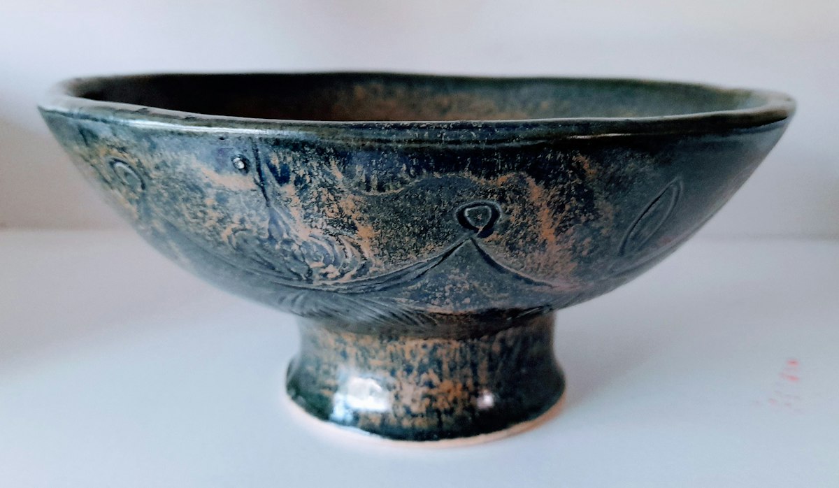 Glazed handmade stoneware bowl seen from the side