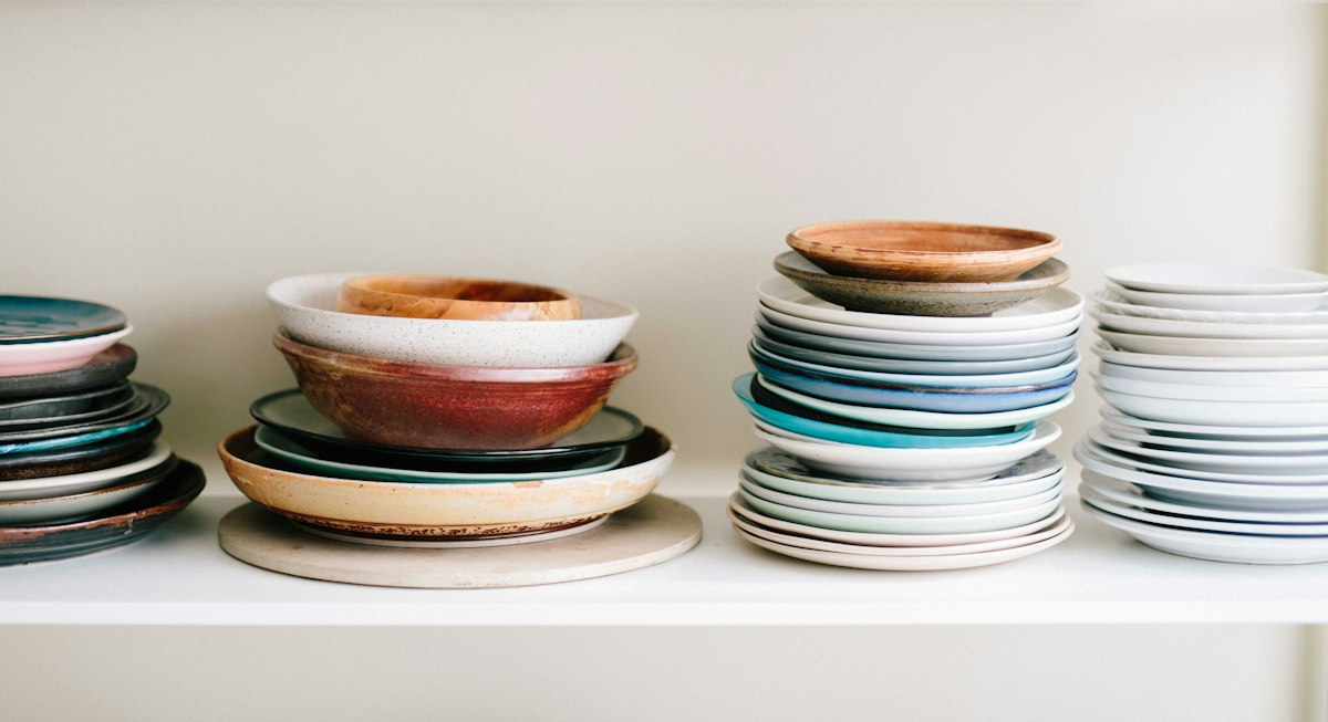 Stack of assorted ceramic plates and saucers